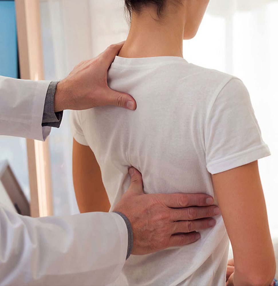 Female patient having a spinal decompression consultation