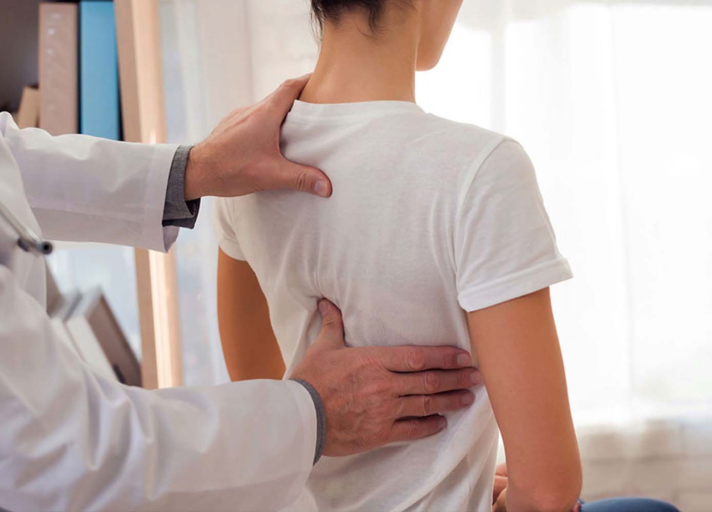 Female patient having a spinal decompression consultation